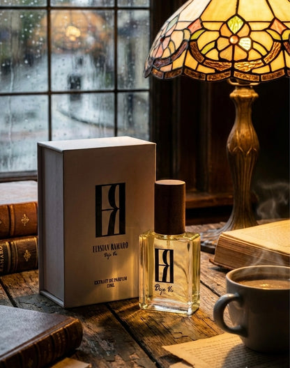 Perfume bottle and packaging on a wooden surface with a lamp and books in the background