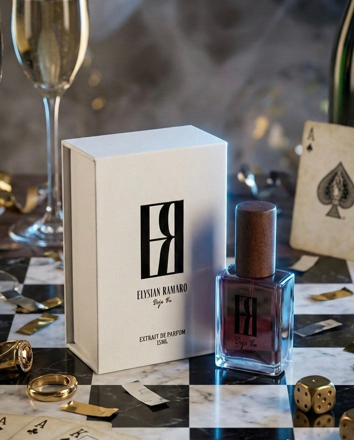 Elysian Ramaro Midnight Celebration perfume bottle and packaging on a table with playing cards and dice.